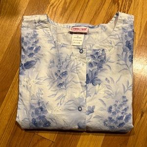 Cherokee Scrub Jacket with front snap closures. White with blue flowers.